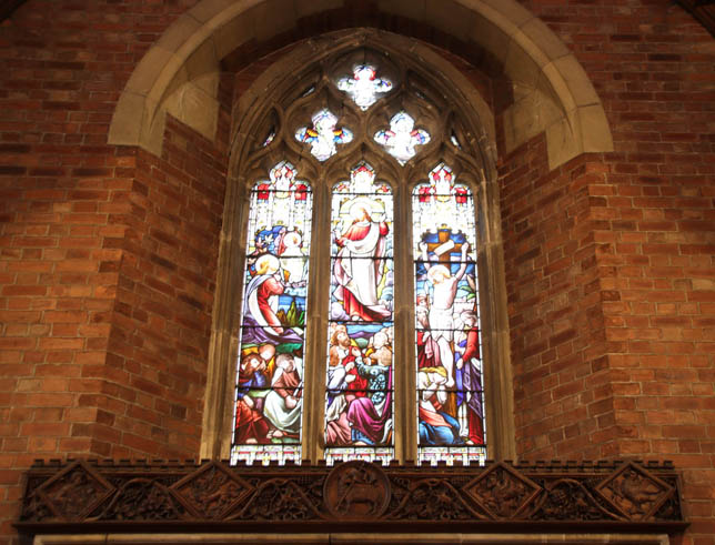 The oak carving by G W Milburn above the altar