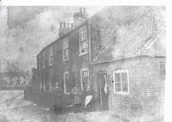 Mr John Thwaites outside his butchers shop